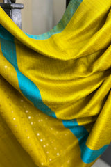 Yellow- greenish pure matka silk saree with contrast firozi border and sequins pallu