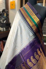 Pearl white Zari checkered pure silk Narayanpet Saree with deep purple border and pallu.