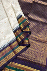 Pearl white Zari checkered pure silk Narayanpet Saree with deep purple border and pallu.