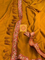 Mustard Coloured Mulmul Saree with rust lace and tassels