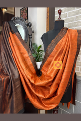 Vibrant Rust coloured Pure Tussar Silk saree with black border and pallu