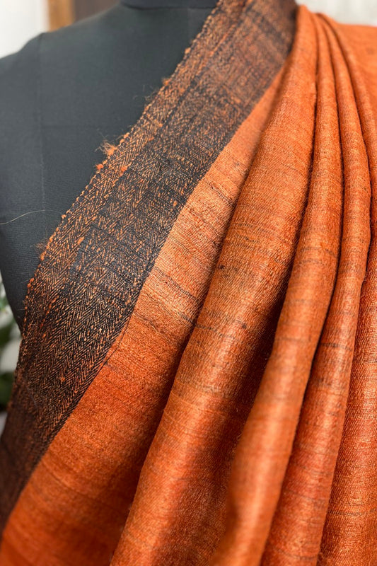 Vibrant Rust coloured Pure Tussar Silk saree with black border and pallu