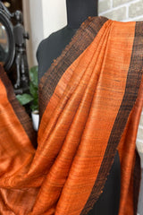 Vibrant Rust coloured Pure Tussar Silk saree with black border and pallu