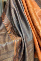 Vibrant Rust coloured Pure Tussar Silk saree with black border and pallu