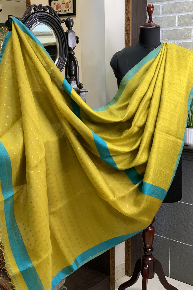 Yellow- greenish pure matka silk saree with contrast firozi border and sequins pallu