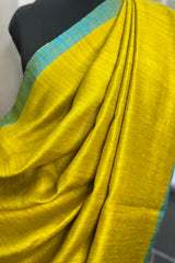 Yellow- greenish pure matka silk saree with contrast firozi border and sequins pallu