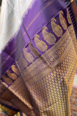 Pearl white Zari checkered pure silk Narayanpet Saree with deep purple border and pallu.