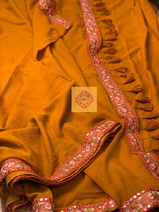 Mustard Coloured Mulmul Saree with rust lace and tassels