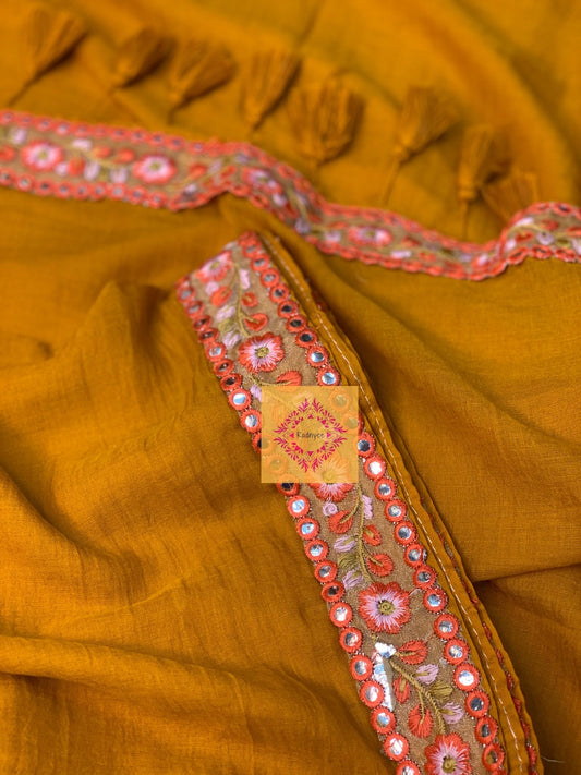 Mustard Coloured Mulmul Saree with rust lace and tassels